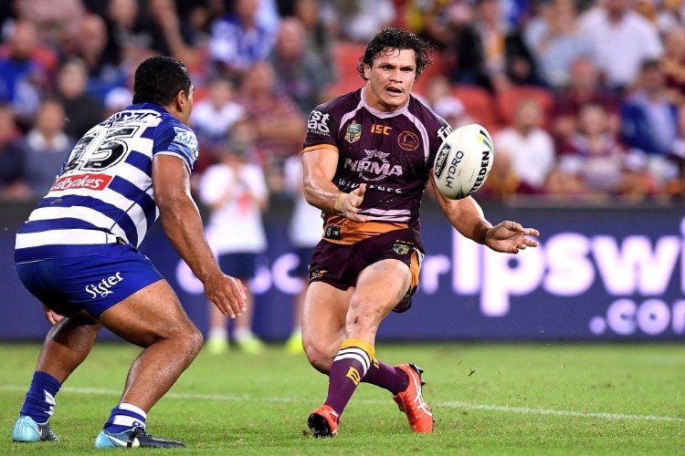 JAMES ROBERTS of the Broncos passes the ball during the NRL match between the Brisbane Broncos and the Canterbury Bulldogs at Suncorp Stadium in Brisbane, Australia.
