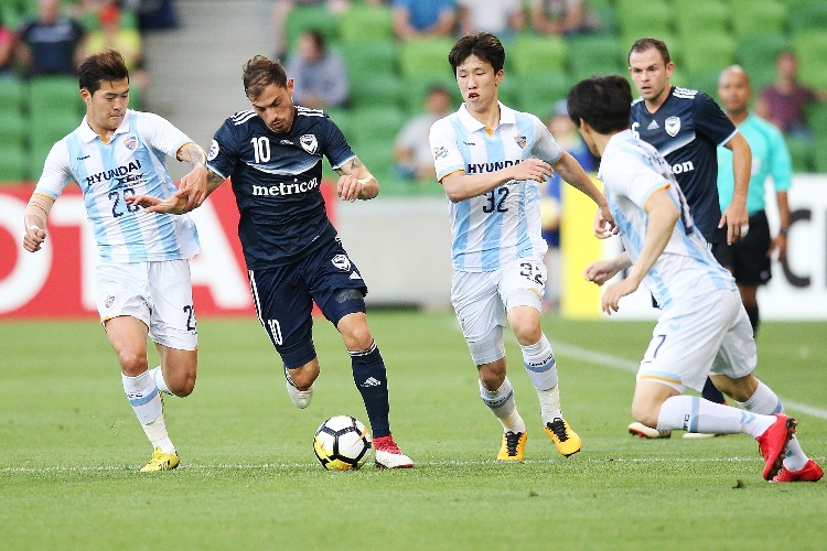 JAMES TROISI of the Victory runs with the ball during the AFC Asian Champions League between the Melbourne Victory and Ulsan Hyundai FC at AAMI Park in Melbourne, Australia.