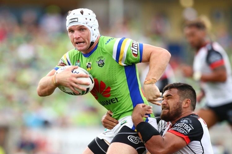 JARROD CROKER of the Raiders is tackled during the NRL match between the Canberra Raiders and the New Zealand Warriors at GIO Stadium in Canberra, Australia.