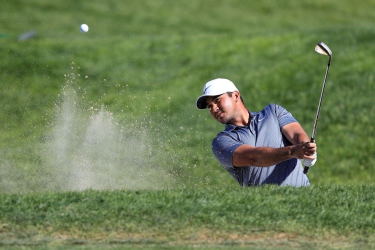 JASON DAY of Australia plays a shot from a bunker on the ninth hole during the final round of the Farmers Insurance Open at Torrey Pines South in San Diego, California.