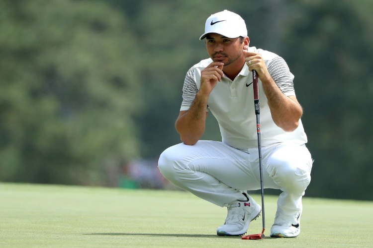 JASON DAY of Australia lines up a putt on the third green during the 2018 Masters Tournament at Augusta National Golf Club in Augusta, Georgia.