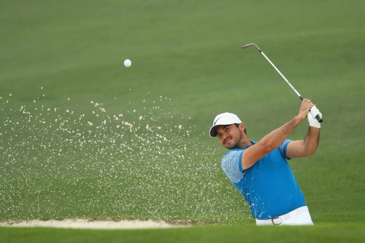 JASON DAY of Australia plays a shot from a bunker on the second hole during the 2018 Masters Tournament at Augusta National Golf Club in Augusta, Georgia.