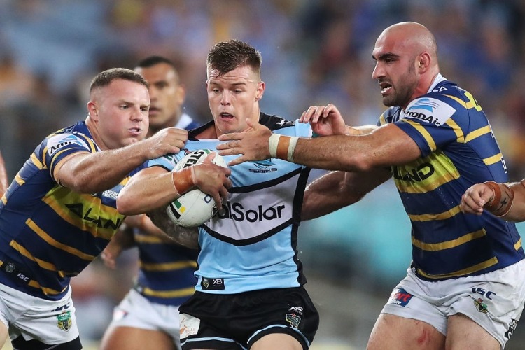 JAYDEN BRAILEY of the Sharks is tackled during the NRL match between the Parramatta Eels and the Cronulla Sharks at ANZ Stadium in Sydney, Australia.