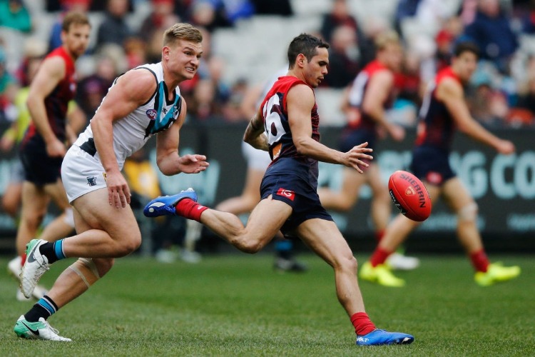 JEFF GARLETT of the Demons kicks the ball during the AFL match between the Melbourne Demons and the Port Adelaide Power at MCG in Melbourne, Australia. JEFF GARLETT of the Demons kicks the ball during the AFL match between the Melbourne Demons and the Port Adelaide Power at MCG in Melbourne, Australia.