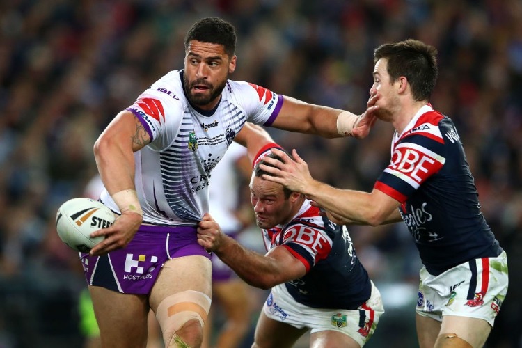 JESSE BROMWICH of the Storm is tackled during the 2018 NRL Grand Final match between the Melbourne Storm and the Sydney Roosters at ANZ in Sydney, Australia.