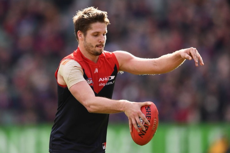 JESSE HOGAN of the Demons kicks during the AFL match between the Melbourne Demons and the Brisbane Lions at MCG in Melbourne, Australia. JESSE HOGAN of the Demons kicks during the AFL match between the Melbourne Demons and the Brisbane Lions at MCG in Melbourne, Australia.