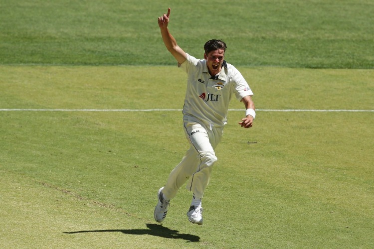 JHYE RICHARDSON of the Warriors celebrates after taking the wicket of the Blues during the Sheffield Shield match between Western Australia and New South Wales at Perth Stadium in Perth, Australia.