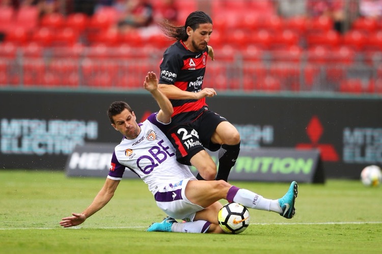 JOEL CHIANESE of the Glory tackles RAUL LLORENTE of the Wanderers during the A-League match between the Western Sydney Wanderers and the Perth Glory at Spotless Stadium Sydney, Australia. JOEL CHIANESE of the Glory tackles RAUL LLORENTE of the Wanderers during the A-League match between the Western Sydney Wanderers and the Perth Glory at Spotless Stadium Sydney, Australia.