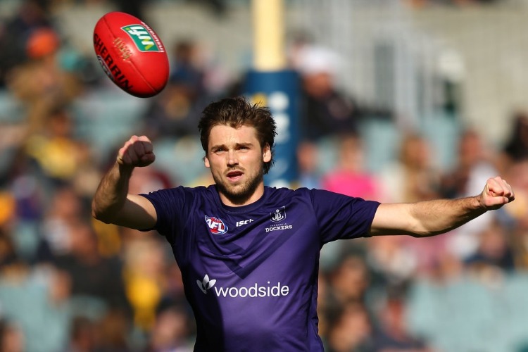 JOEL HAMLING of the Dockers warms up before the AFL match between the Fremantle Dockers and the West Coast Eagles at Domain Stadium in Perth, Australia.