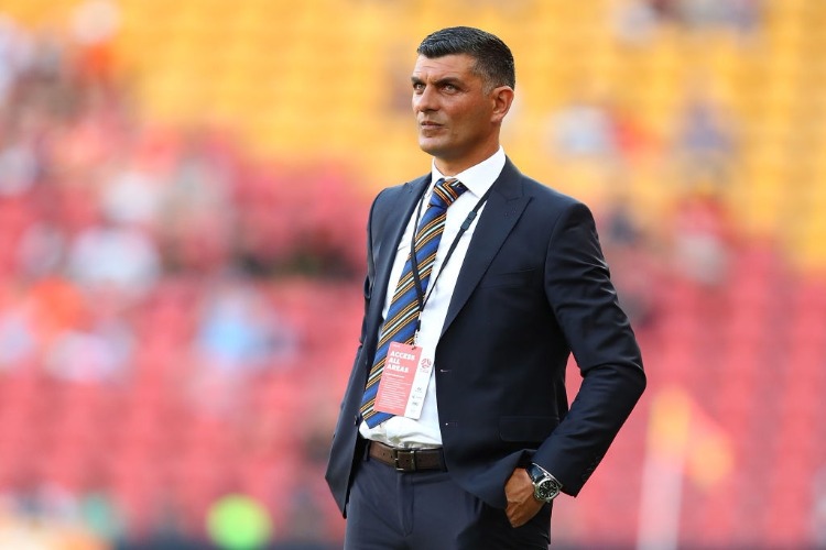 Roar coach JOHN ALOISI looks on during the round five A-League match between the Brisbane Roar and the Central Coast Mariners at Suncorp Stadium in Brisbane, Australia.