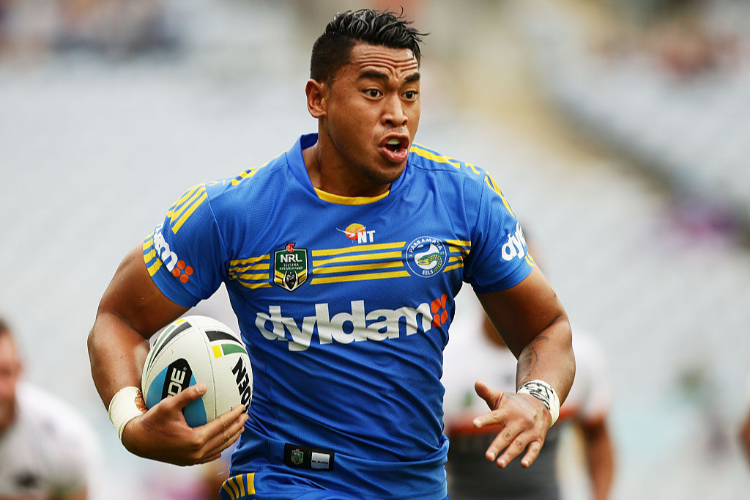 JOHN-FOLAU of the Eels makes a break during the NRL match between the Parramatta Eels and the Wests Tigers in Sydney, Australia.