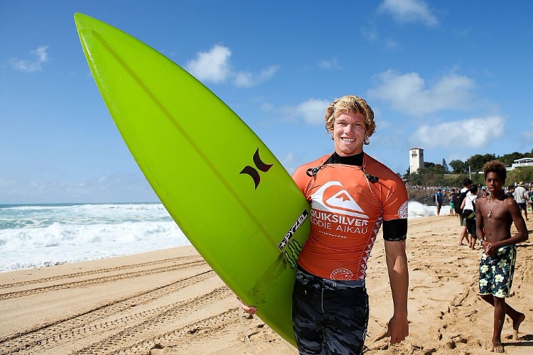 Professional surfer JOHN JOHN FLORENCE poses for a picture at The Quiksilver in Memory of Eddie Aikau at Waimea Bay in Waimea, Hawaii.