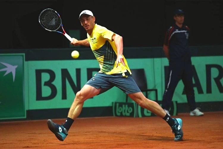 JOHN MILLMAN of Australia in action against David Goffin of Belgium during the Davis Cup World Group semi final match at Palais 12 in Brussels, Belgium.