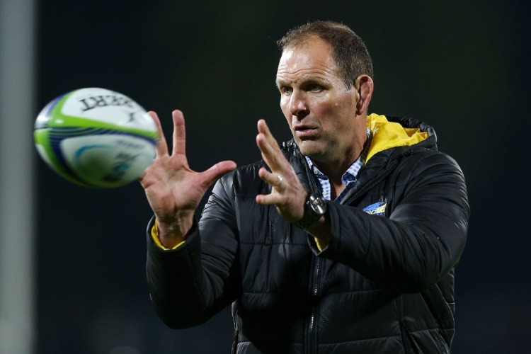 Assistant Coach JOHN PLUMTREE of the Hurricanes takes players through a warm-up drill during the Super Rugby match between the Hurricanes and the Brumbies at McLean Park in Napier, New Zealand.