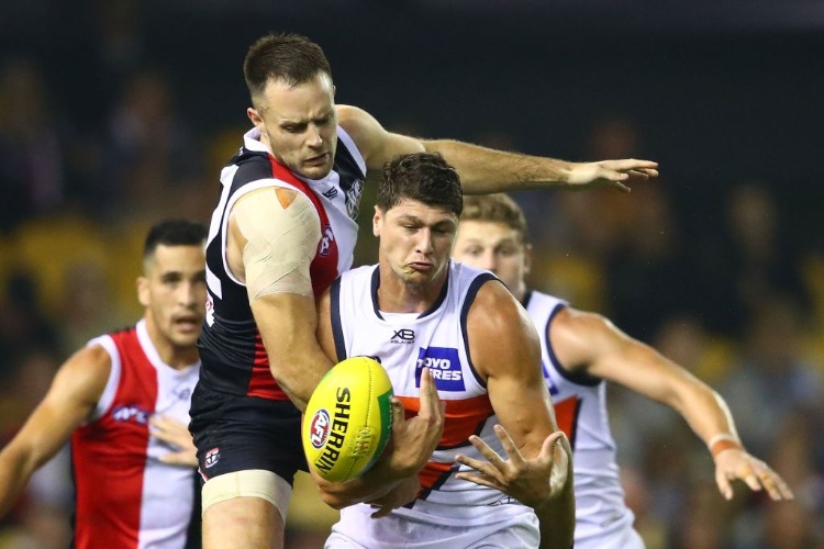 JONATHON PATTON of the Giants and Nathan Brown of the Saints compete for the ball during the AFL match between the St Kilda Saints and the Greater Western Sydney Giants at Etihad Stadium in Melbourne, Australia.