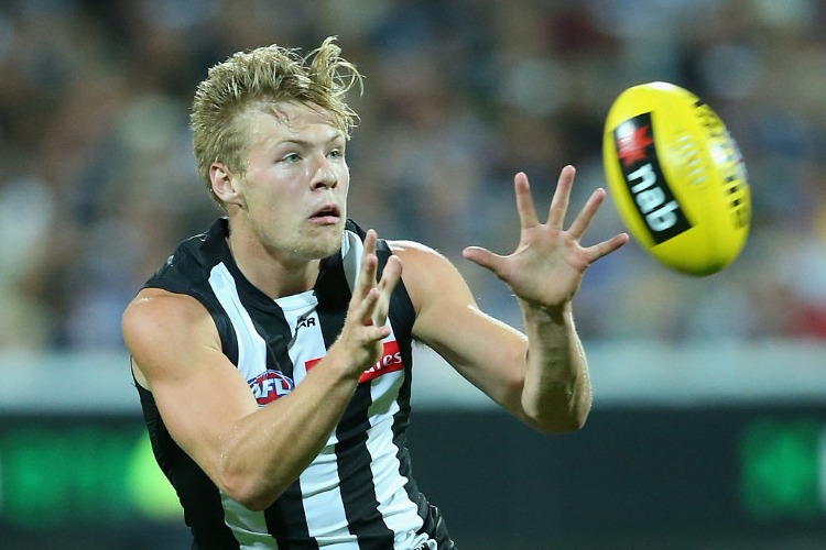 JORDAN DE GOEY of the Magpies marks during the 2016 NAB Challenge match between the Geelong Cats and the Collingwood Magpies at Simonds Stadium in Geelong, Australia.