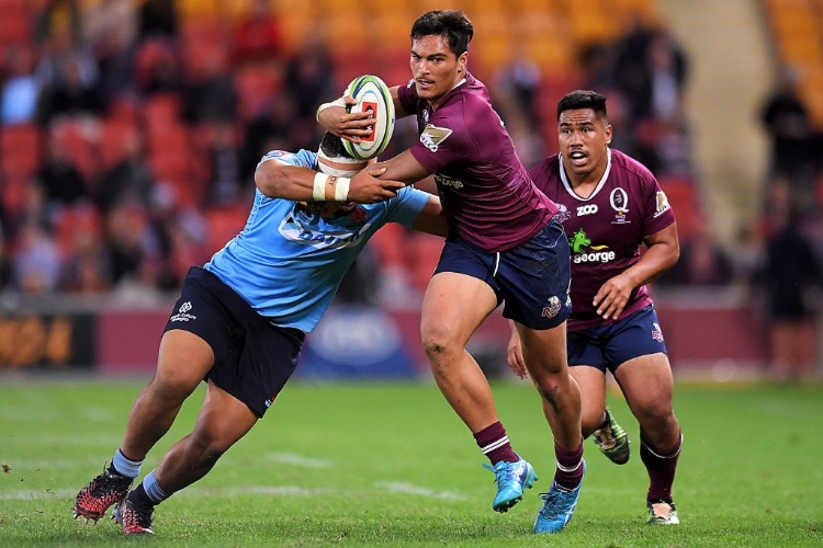JORDAN PETAIA of the Reds is tackled during the Super Rugby match between the Reds and the Waratahs at Suncorp Stadium in Brisbane, Australia.