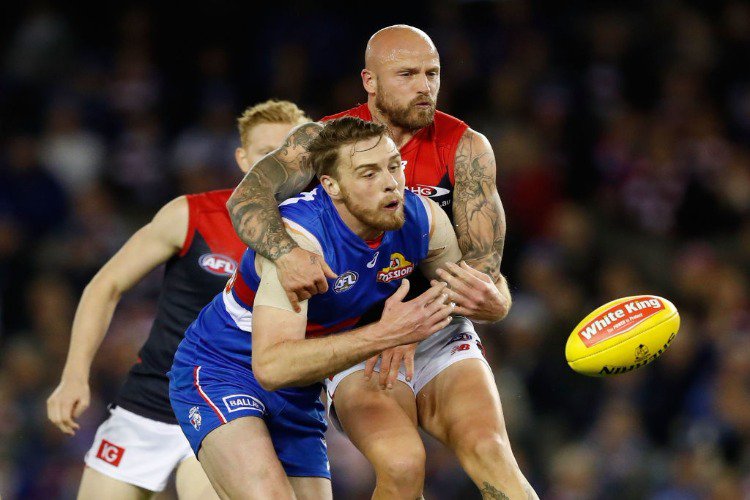 NATHAN JONES of the Demons and JORDAN ROUGHEAD of the Bulldogs compete for the ball during the 2017 AFL match between the Western Bulldogs and the Melbourne Demons at Etihad Stadium in Melbourne, Australia.