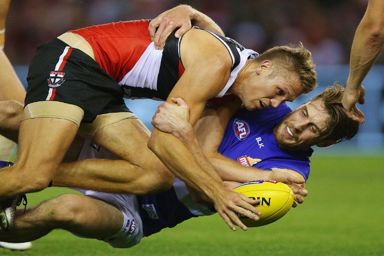 JORDAN ROUGHEAD of the Bulldogs tackles SEAN DEMPSTER of the Saints during the match between the St.Kilda Saints and the Western Bulldogs at Etihad Stadium in Melbourne, Australia.