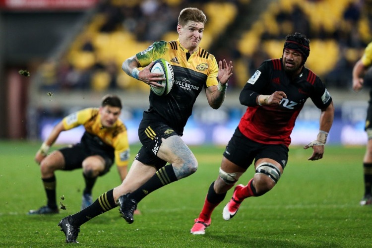 JORDIE BARRETT of the Hurricanes breaks away for a try during the Super Rugby match between the Hurricanes and the Crusaders at Westpac Stadium in Wellington, New Zealand.