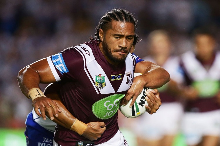 JORGE TAUFUA of the Sea Eagles is tackled by Sam Perrett of the Bulldogs during the NRL match between the Manly Warringah Sea Eagles and the Canterbury Bulldogs at Brookvale Oval in Sydney, Australia.