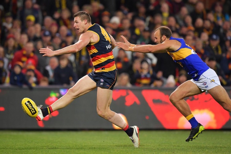 JOSH JENKINS of the Crows kicks the ball during the AFL match between the Adelaide Crows and the West Coast Eagles at AO in Adelaide, Australia.