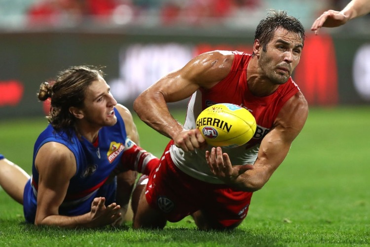 JOSH KENNEDY of the Swans gets a handball away despite pressure from Marcus Bontempelli of the Bulldogs during the AFL match between the Sydney Swans and the Western Bulldogs at SCG in Sydney, Australia. JOSH KENNEDY of the Swans gets a handball away despite pressure from Marcus Bontempelli of the Bulldogs during the AFL match between the Sydney Swans and the Western Bulldogs at SCG in Sydney, Australia.