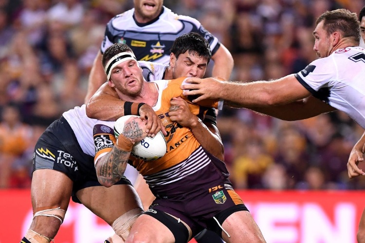 JOSH MCGUIRE of the Broncos takes on the defence during the NRL match between the Brisbane Broncos and the North Queensland Cowboys at Suncorp Stadium in Brisbane, Australia.