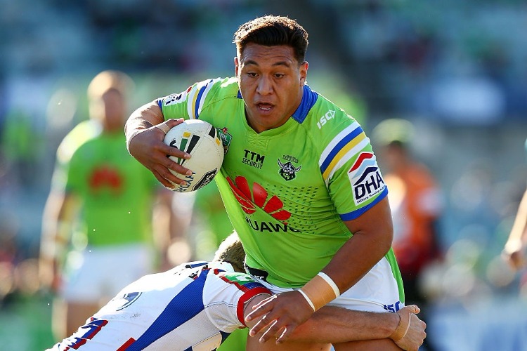 JOSH PAPALII of the Raiders runs the ball during the NRL match between the Canberra Raiders and the Newcastle Knights at GIO Stadium in Canberra, Australia.