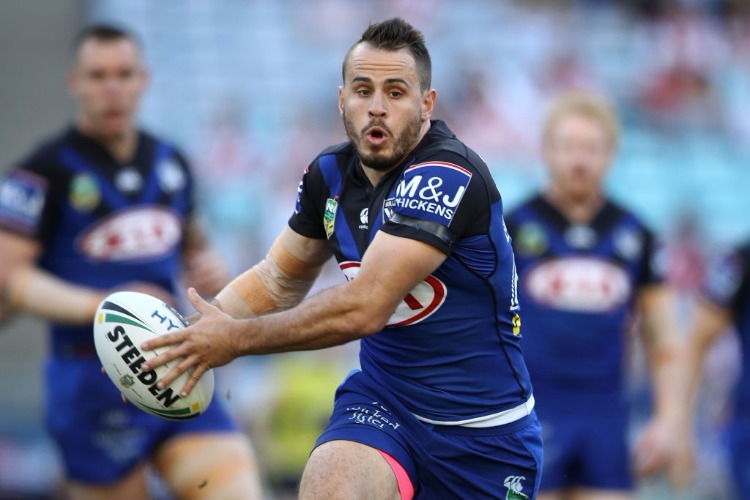 JOSH REYNOLDS of the Bulldogs runs the ball during the NRL match between the St George Illawarra Dragons and the Canterbury Bulldogs at ANZ Stadium in Sydney, Australia.