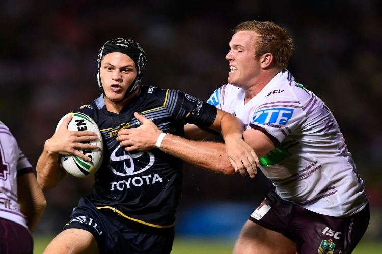 KALYN PONGA of the Cowboys is tackled by Jake Trbojevic of the Sea Eagles during the NRL match between the North Queensland Cowboys and the Manly Sea Eagles at 1300SMILES Stadium in Townsville, Australia.