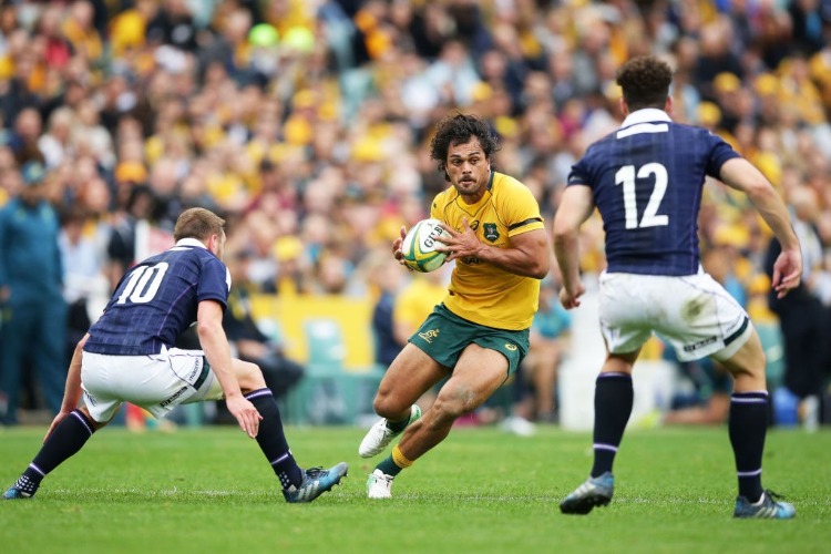 KARMICHAEL HUNT of the Wallabies runs with the ball during the International Test match at Allianz Stadium in Sydney, Australia.