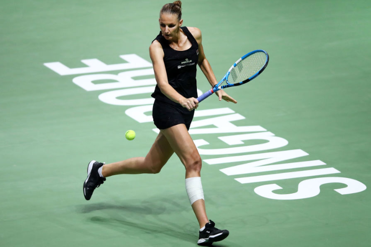 KAROLINA PLISKOVA of the Czech Republic plays a backhand in her singles match against Petra Kvitova of the Czech Republic during the BNP Paribas WTA Finals Singapore presented by SC Global at Singapore Sports Hub in Singapore. KAROLINA PLISKOVA of the Czech Republic plays a backhand in her singles match against Petra Kvitova of the Czech Republic during the BNP Paribas WTA Finals Singapore presented by SC Global at Singapore Sports Hub in Singapore.