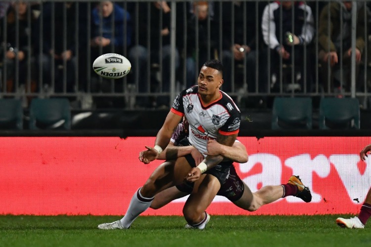 KEN MAUMALO of the Warriors offloads the ball during the NRL match between the Manly Sea Eagles and the New Zealand Warriors at AMI Stadium in Christchurch, New Zealand.