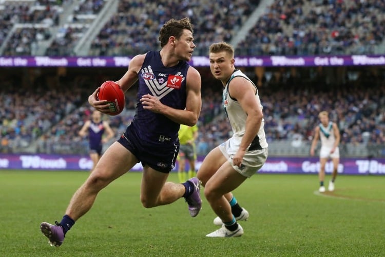 LACHIE NEALE of the Dockers looks to pass the ball during the AFL match between the Fremantle Dockers and the Port Adelaide Power at OS in Perth, Australia.
