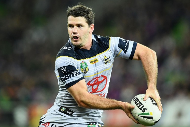LACHLAN COOTE of the Cowboys passes the ball during the NRL match between the Melbourne Storm and the North Queensland Cowbpys at AAMI Park in Melbourne, Australia.
