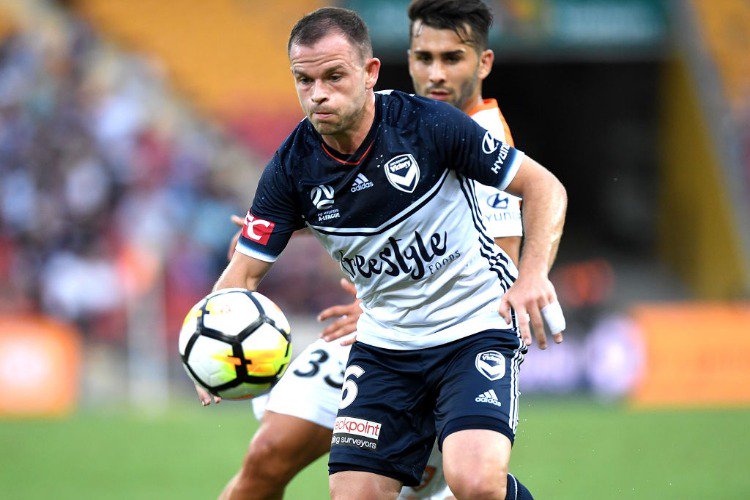 LEIGH BROXHAM of the Victory breaks away from the defence during the A-League match between the Brisbane Roar and the Melbourne Victory at Suncorp Stadium in Brisbane, Australia.