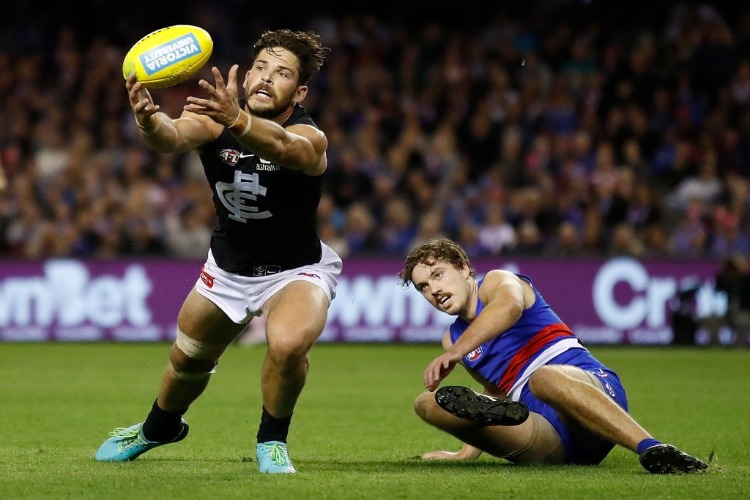 LEVI CASBOULT of the Blues and Zaine Cordy of the Bulldogs in action during AFL match between the Western Bulldogs and the Carlton Blues at Etihad Stadium in Melbourne, Australia.