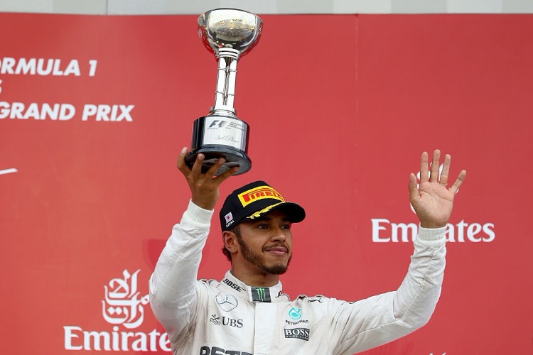 LEWIS HAMILTON of Great Britain and Mercedes GP celebrates on the podium after finishing third during the Formula One Grand Prix of Japan at Suzuka Circuit in Suzuka. LEWIS HAMILTON of Great Britain and Mercedes GP celebrates on the podium after finishing third during the Formula One Grand Prix of Japan at Suzuka Circuit in Suzuka.