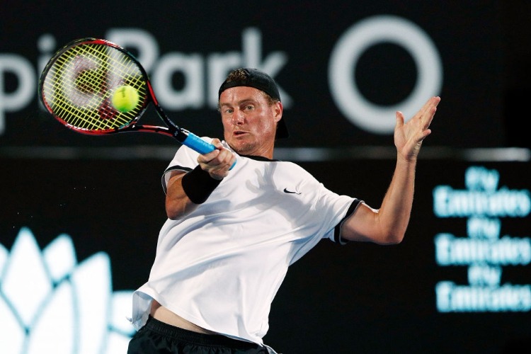 LLEYTON HEWITT of Australia plays a forehand in a Fast Fours Exhibition Match against Grigor Dimitrov of Bulgaria during the 2018 Sydney International at Sydney Olympic Park Tennis Centre in Sydney, Australia.