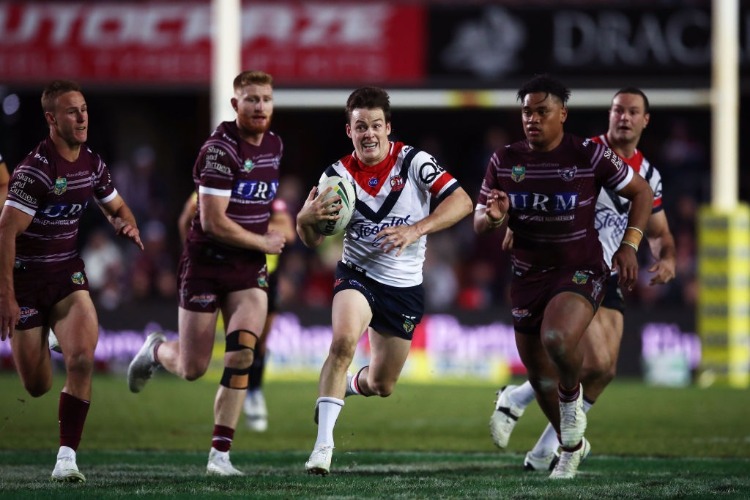 LUKE KEARY of the Roosters makes a break during the NRL match between the Manly Sea Eagles and the Sydney Roosters at Lottoland in Sydney, Australia.