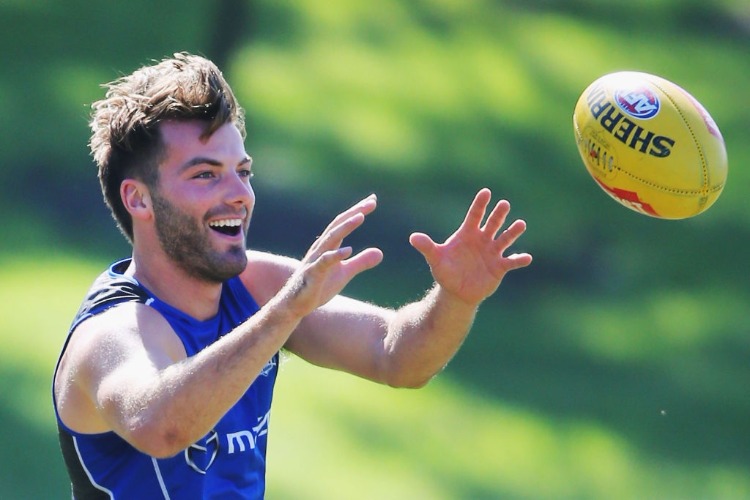 LUKE MCDONALD of the Kangaroos marks the ball during a North Melbourne Kangaroos AFL training session at Arden Street Ground in Melbourne, Australia. LUKE MCDONALD of the Kangaroos marks the ball during a North Melbourne Kangaroos AFL training session at Arden Street Ground in Melbourne, Australia.