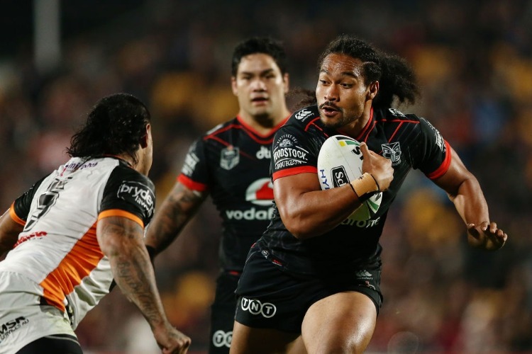 Bunty Afoa of the Warriors makes a run at MAHE FONUA of the Tigers during the NRL match between the New Zealand Warriors and the Wests Tigers at Mt Smart Stadium in Auckland, New Zealand.