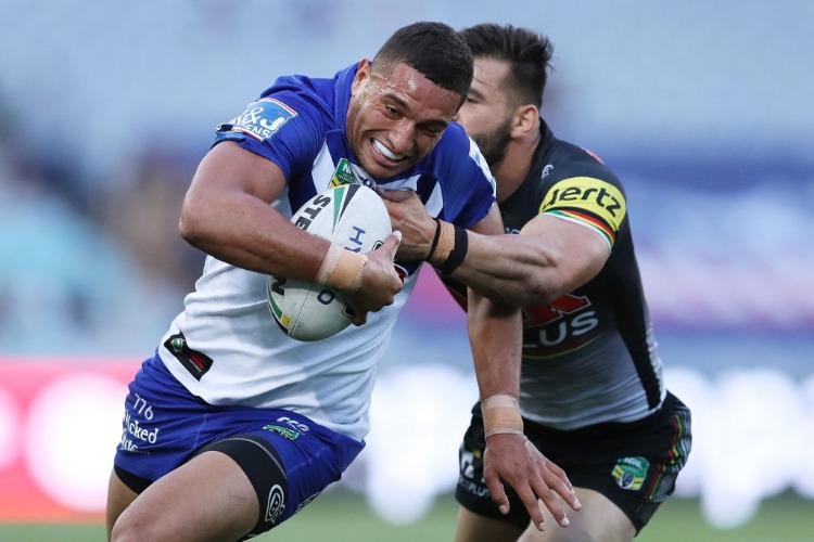 MARCELO MONTOYA of the Bulldogs takes on Josh Mansour of the Panthers during the NRL match between the Bulldogs and the Panthers at ANZ Stadium in Sydney, Australia.
