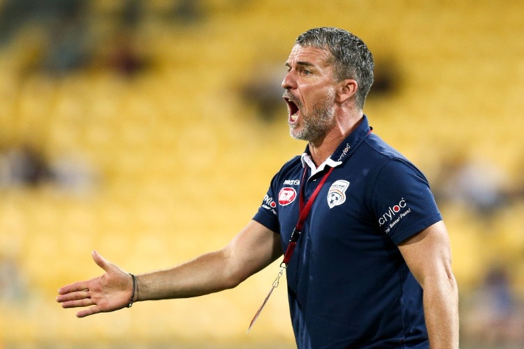 Coach MARCO KURZ of Adelaide United talks to his players during the A-League match between the Wellington Phoenix and Adelaide United at Westpac Stadium in Wellington, New Zealand.
