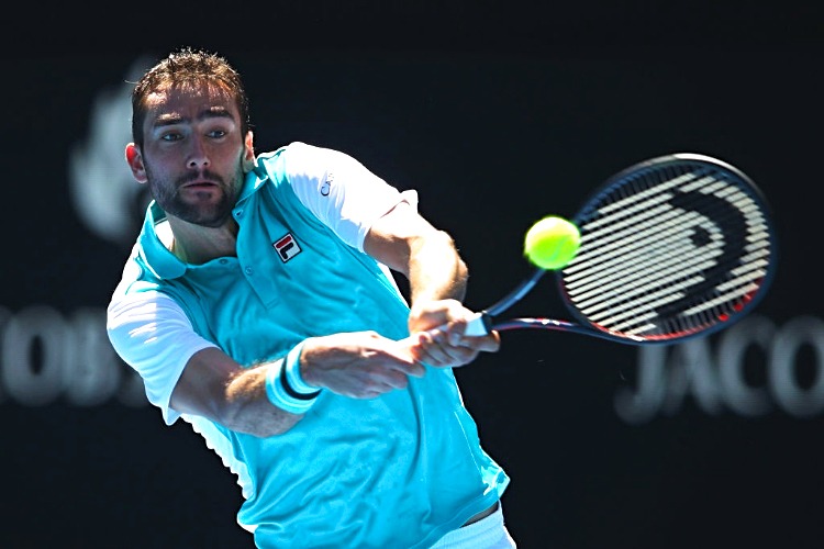 MARIN CILIC of Croatia plays a backhand against Joao Sousa of Portugal of the 2018 Australian Open at Melbourne Park in Australia.