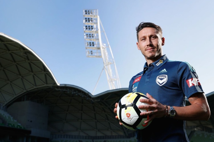 New recruit MARK MILLIGAN poses during a Melbourne Victory A-League media announcement at AAMI Park in Melbourne, Australia.