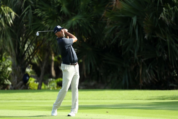 MATT KUCHAR of the United States plays his second shot on the 17th hole during the final round of the Mayakoba Golf Classic at El Camaleon Mayakoba Golf Course in Playa del Carmen, Mexico.