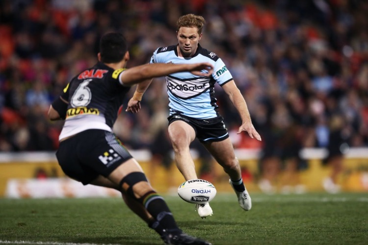 MATT MOYLAN of the Sharks takes on the defence during the NRL match between the Panthers and the Sharks at Panthers Stadium in Penrith, Australia.