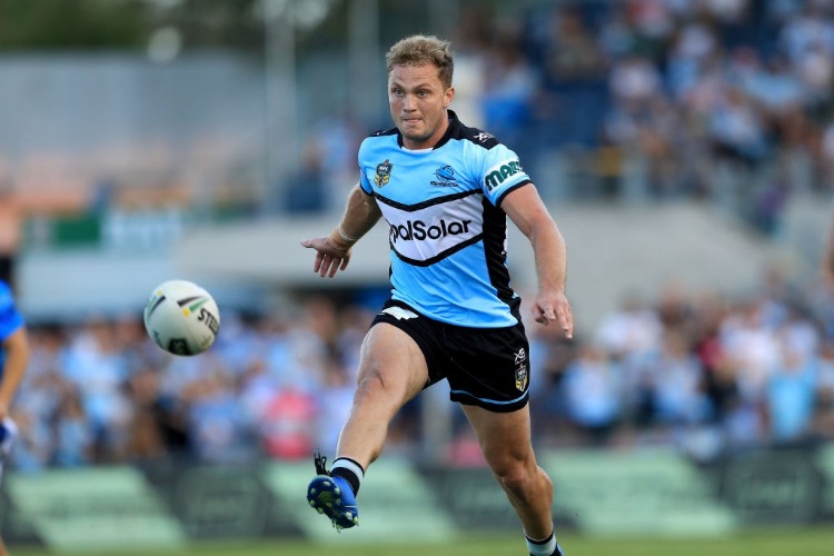 MATT MOYLAN of the Sharks kicks the ball during the NRL match between the Cronulla Sharks and the Penrith Panthers at Southern Cross Group Stadium in Sydney, Australia.
